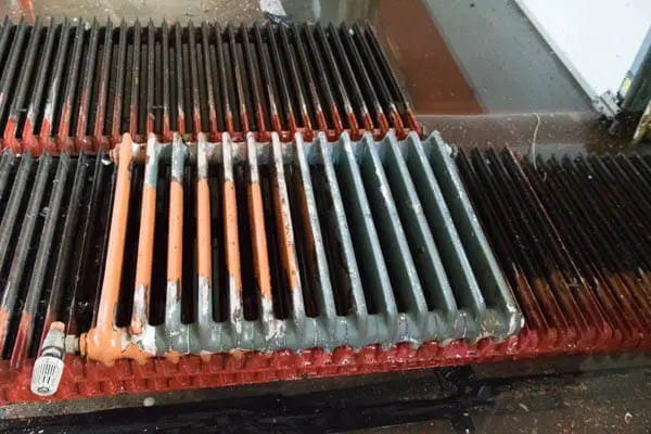 metal2009 cast iron radiators stripped of paint with high pressure water jet