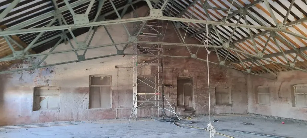 Wakefield warehouse brick wall during lead paint removal with sand jet
