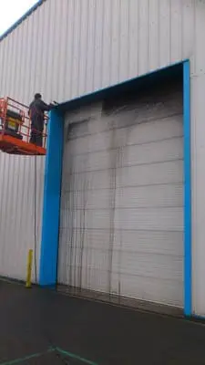 pwash002 industrial unit door being pressure washed