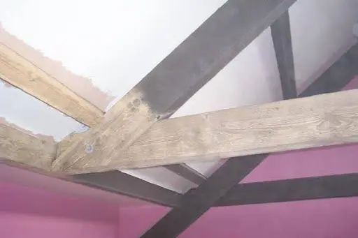 Greenleaf - Greenleaf Contractors | Sandblasting And Pressure Washing | UK Exposed wooden roof beams and steel joists inside building during restoration after paint stripping
