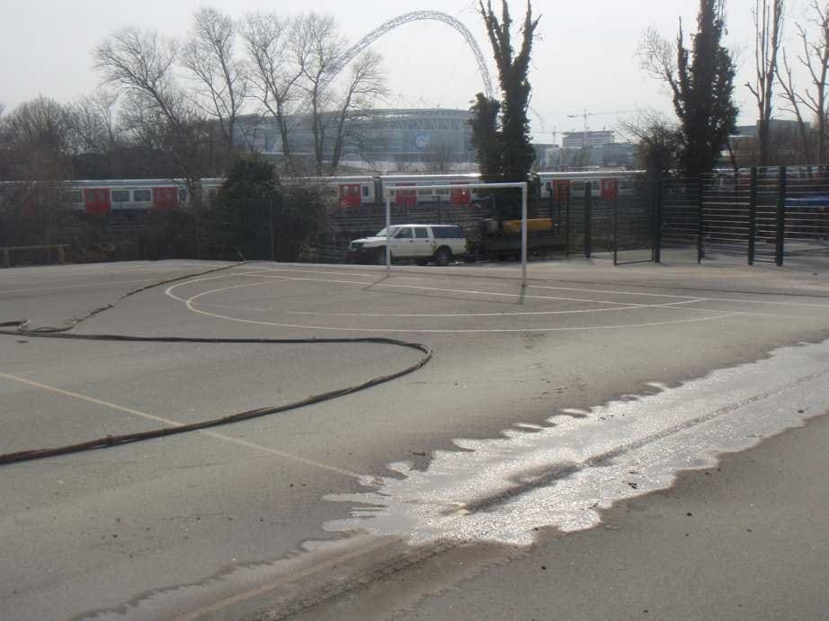 OLYMPUS DIGITAL CAMERA - Greenleaf Contractors | Sandblasting And Pressure Washing | UK debris field after sand jet cleaning playground in north london - wembly stadium in background